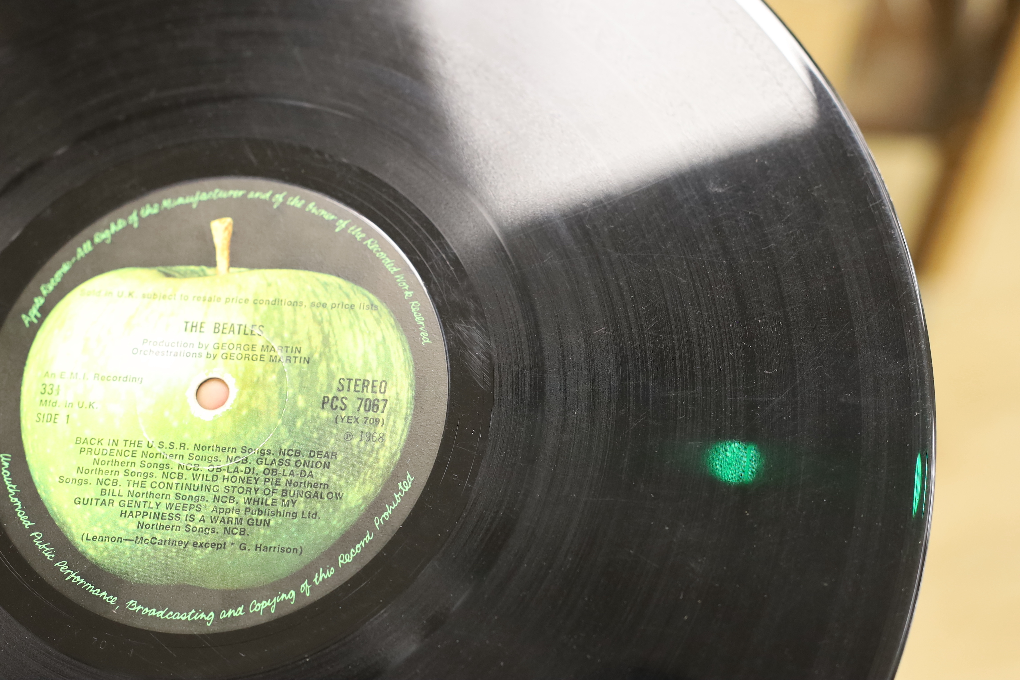 The Beatles; The White Album, top opening cover numbered 0557785, two LPs with set of four photographs and booklet, missing inner sleeves